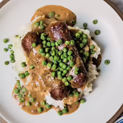 Meaty Vegan Bangers and Mash With Herbed Gravy