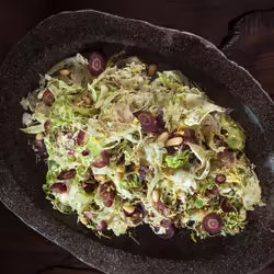 Vegan Shaved Brussels Sprouts With Zaâatar, Lemon, and Pine Nuts