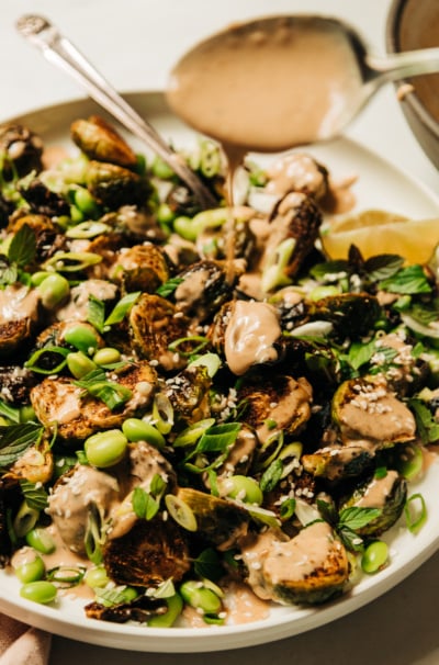 Crispy Roasted Brussels Sprouts with Edamame & Peanut Sauce