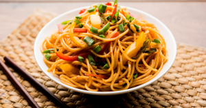 This spicy peanut noodle bowl is rich, creamy, and full of umami