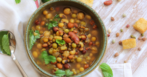 Warming lentil-barley vegan stew with herby swirl