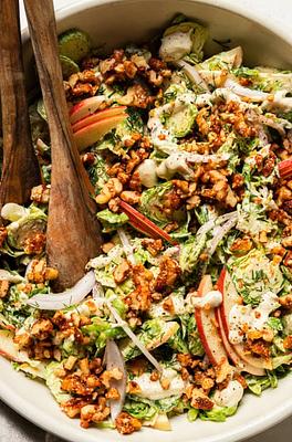 Shaved Brussels Sprouts Salad with Creamy Garlic Dressing & Spiced Maple Walnuts