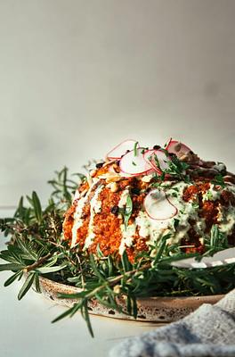 Romesco Roasted Whole Cauliflower with Herbed Tahini Cream