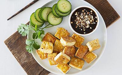 Crispy Tofu Dipped In Sweet And Sour Sauce