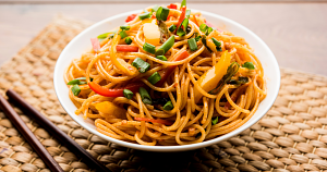 This spicy peanut noodle bowl is rich, creamy, and full of umami