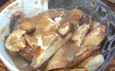 This Vegan Poutine Recipe Actually Pulls Off Cheese Curds